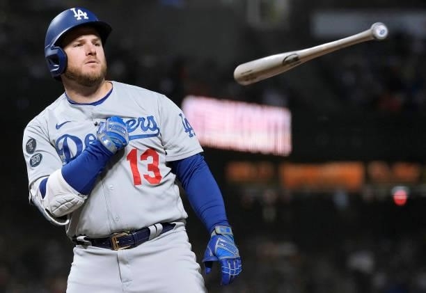Max Muncy of the Los Angeles Dodgers reacts tossing his bat away after striking out against the San Francisco Giants in the top of the fifth inning...
