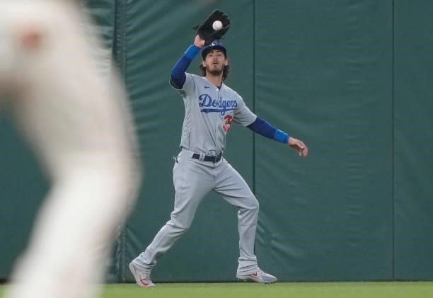 Cody Bellinger of the Los Angeles Dodgers catches a fly ball off the bat of Thairo Estrada of the San Francisco Giants in the bottom of the fourth...