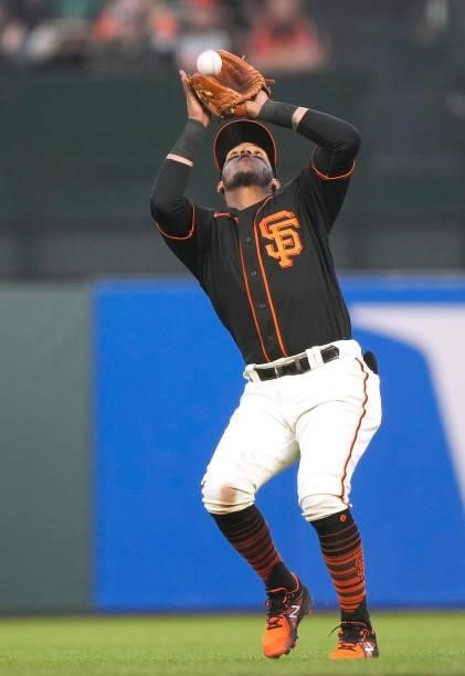 Thairo Estrada of the San Francisco Giants catches a pop-up off the bat of Chris Taylor of the Los Angeles Dodgers in the top of the fourth inning at...