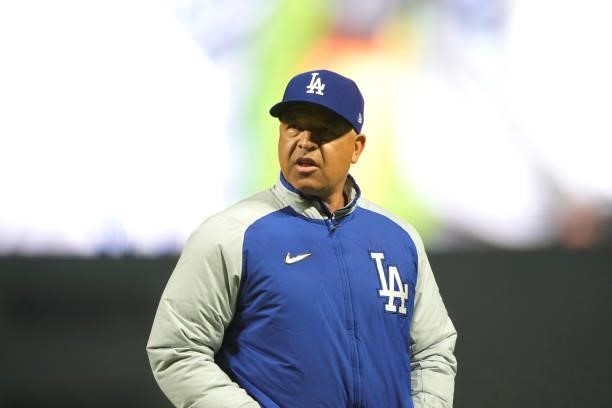 Manager Dave Roberts of the Los Angeles Dodgers walks back to the dugout after making a pitching change against the San Francisco Giants in the...