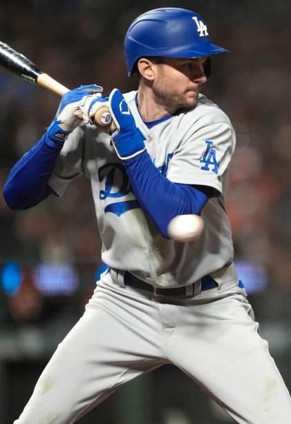 Trea Turner of the Los Angeles Dodgers gets hit with a pitch against the San Francisco Giants in the top of the ninth inning at Oracle Park on...