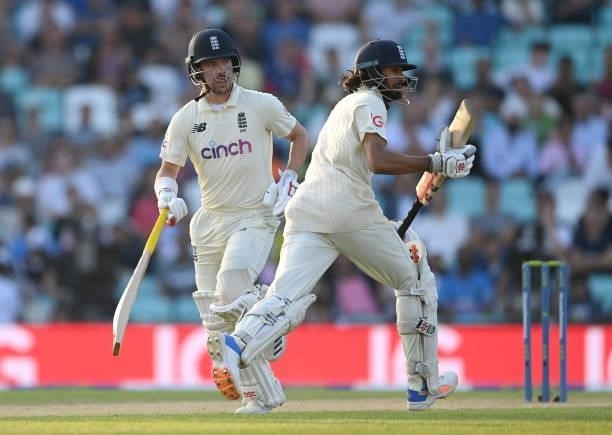 Rory Burns and Haseeb Hameed of England run during the fourth day of the 4th LV= Test Match between England and India at The Kia Oval on September...