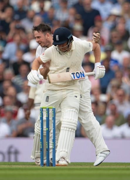 Member of the public runs onto the pitch and barges Jonny Bairstow of England during the Fourth LV= Insurance Test Match: Day Two between England and...