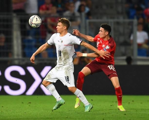Nicolo Barella of Italy competes for the ball with Ruben Vargas of Switzerland during the 2022 FIFA World Cup Qualifier match between Switzerland and...