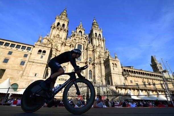 Pavel Sivakov of Russia and Team INEOS Grenadiers competes in the Plaza del Obradoiro with the Cathedral in the background during the 76th Tour of...