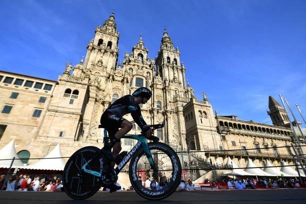 Nicholas Schultz of Australia and Team BikeExchange competes in the Plaza del Obradoiro with the Cathedral in the background during the 76th Tour of...