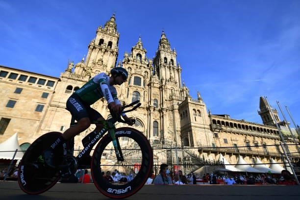 Aritz Bagues Kalparsoro of Spain and Team Caja Rural-Seguros RGA competes in the Plaza del Obradoiro with the Cathedral in the background during the...