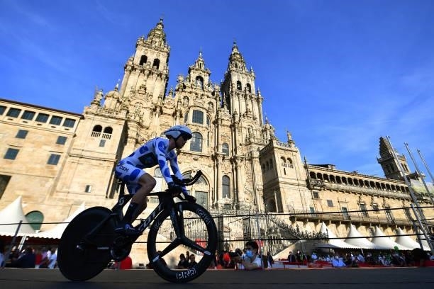 Michael Storer of Australia and Team DSM polka dot mountain jersey competes in the Plaza del Obradoiro with the Cathedral in the background during...