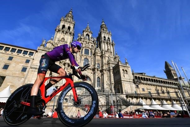 Ander Okamika Bengoetxea of Spain and Team Burgos - BH competes in the Plaza del Obradoiro with the Cathedral in the background during the 76th Tour...