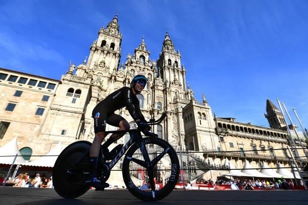 Chris Hamilton of Australia and Team DSM competes in the Plaza del Obradoiro with the Cathedral in the background during the 76th Tour of Spain 2021,...