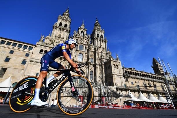 Mauri Vansevenant of Belgium and Team Deceuninck - Quick-Step competes in the Plaza del Obradoiro with the Cathedral in the background during the...