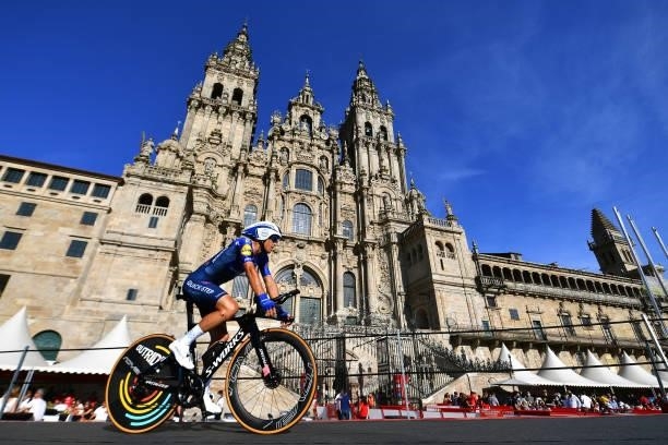Andrea Bagioli of Italy and Team Deceuninck - Quick-Step competes in the Plaza del Obradoiro with the Cathedral in the background during the 76th...
