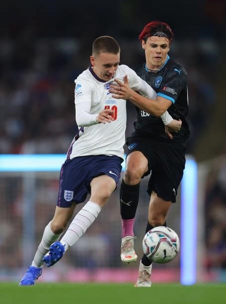 Aitch of England is challenged by Yungblud of Soccer Aid World XI during the Soccer Aid for Unicef 2021 match between England and Soccer Aid World XI...