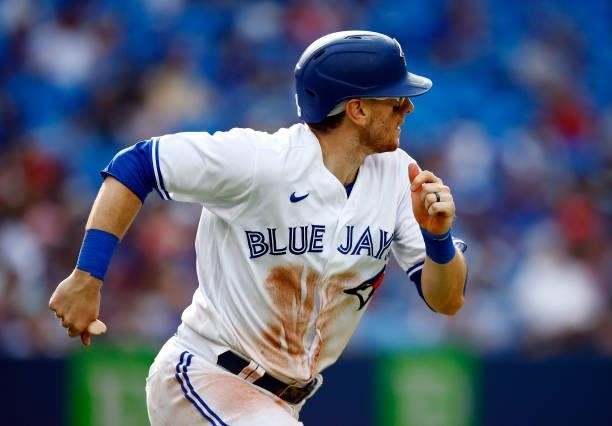 Danny Jansen of the Toronto Blue Jays runs to first base during a MLB game against the Oakland Athletics at Rogers Centre on September 4, 2021 in...