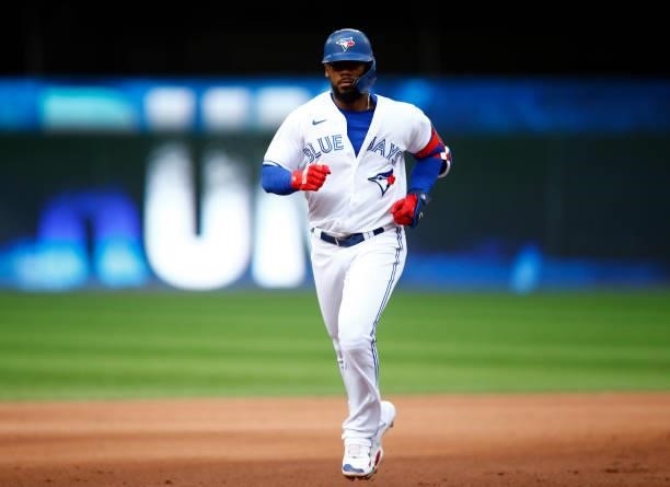 Teoscar Hernandez of the Toronto Blue Jays runs home after hitting his 100th career home run during a MLB game against the Oakland Athletics at...
