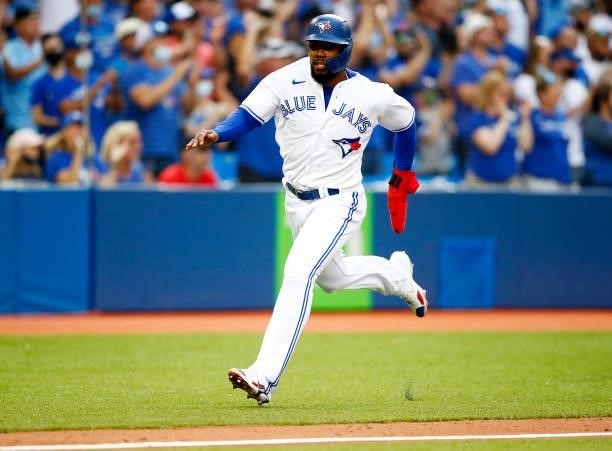 Teoscar Hernandez of the Toronto Blue Jays runs home during a MLB game against the Oakland Athletics at Rogers Centre on September 4, 2021 in...