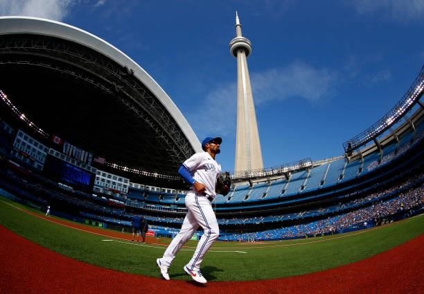 Marcus Semien of the Toronto Blue Jays runs to the dugout prior to a MLB game against the Oakland Athletics at Rogers Centre on September 4, 2021 in...