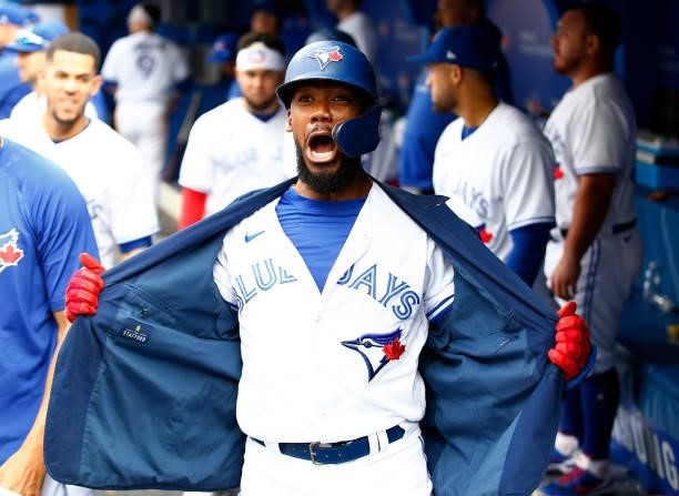 Teoscar Hernandez of the Toronto Blue Jays celebrates after hitting his 100th career home run during a MLB game against the Oakland Athletics at...