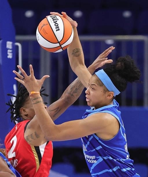 Candace Parker of the Chicago Sky rebounds over Riquna Williams of the Las Vegas Aces at Wintrust Arena on September 05, 2021 in Chicago, Illinois....