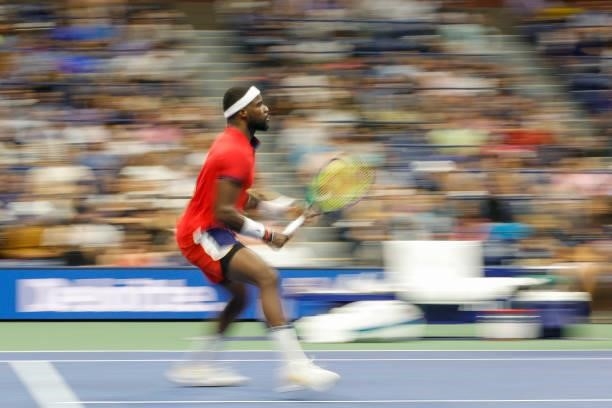 Frances Tiafoe of the United States looks to return the ball as he plays against Felix Auger-Aliassime of Canada during his Men’s Singles round of 16...