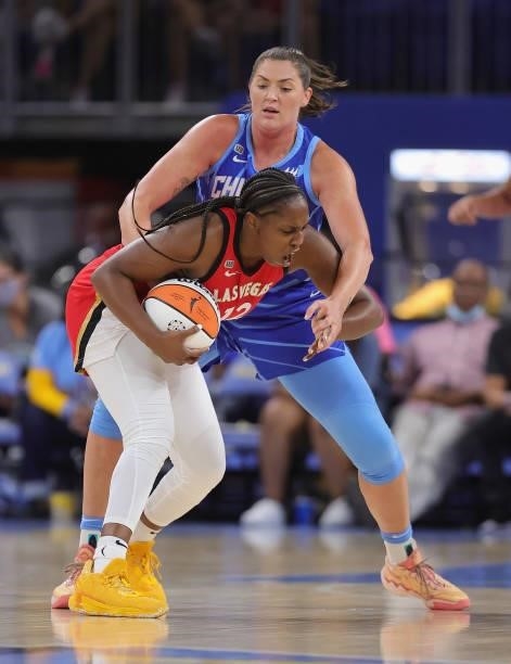 Chelsea Gray of the Las Vegas Aces gets wrapped up by Stefanie Dolson of the Chicago Sky at Wintrust Arena on September 05, 2021 in Chicago,...
