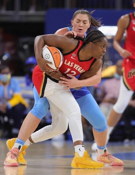 Chelsea Gray of the Las Vegas Aces gets wrapped up by Stefanie Dolson of the Chicago Sky at Wintrust Arena on September 05, 2021 in Chicago,...
