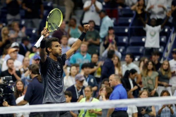 Felix Auger-Aliassime of Canada reacts after winning against Frances Tiafoe of the United States during his Men’s Singles round of 16 match on Day...