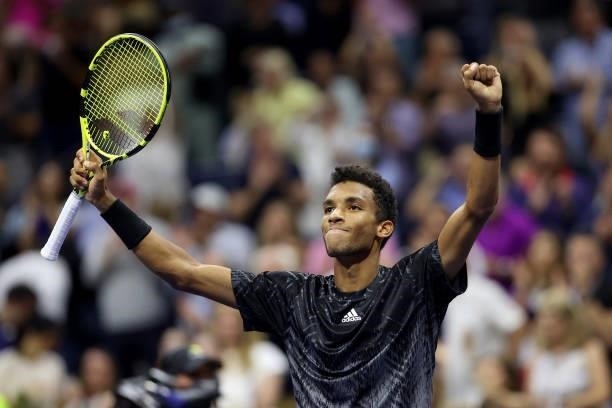 Felix Auger-Aliassime of Canada reacts after winning against Frances Tiafoe of the United States during his Men’s Singles round of 16 match on Day...