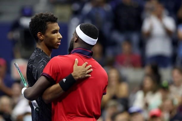 Felix Auger-Aliassime of Canada and Frances Tiafoe of the United States meet at center court after Auger-Aliassime won during their Men’s Singles...