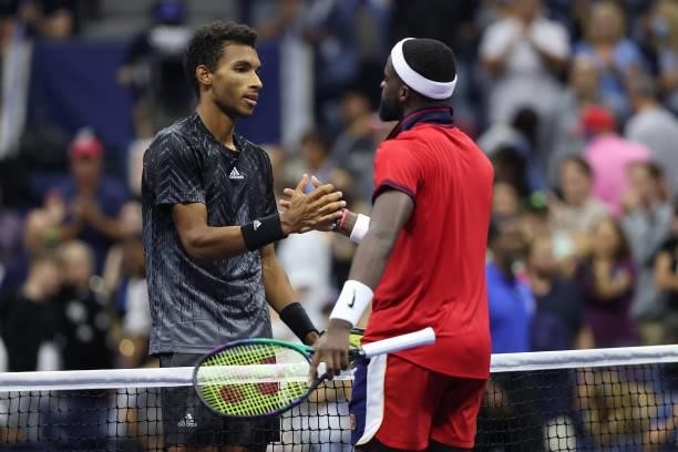 Felix Auger-Aliassime of Canada and Frances Tiafoe of the United States meet at center court after Auger-Aliassime won during their Men’s Singles...