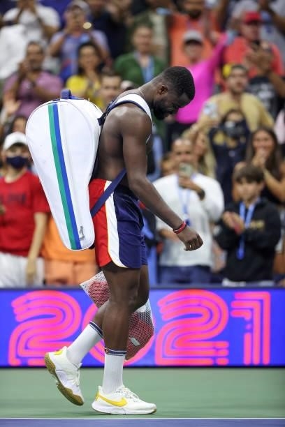 Frances Tiafoe of the United States walks off court after losing against Felix Auger-Aliassime of Canada during his Men’s Singles round of 16 match...