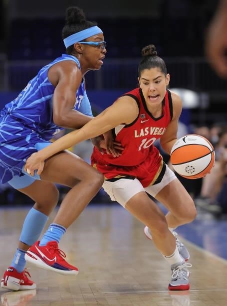 Kelsey Plum of the Las Vegas Aces moves against Diamond DeShields of the Chicago Sky at Wintrust Arena on September 05, 2021 in Chicago, Illinois....