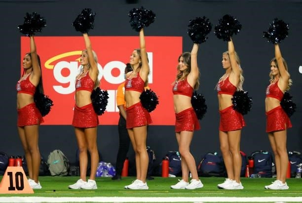 Arizona Wildcats cheerleaders stand on the team's sideline during the Good Sam Vegas Kickoff Classic against the Brigham Young Cougars at Allegiant...
