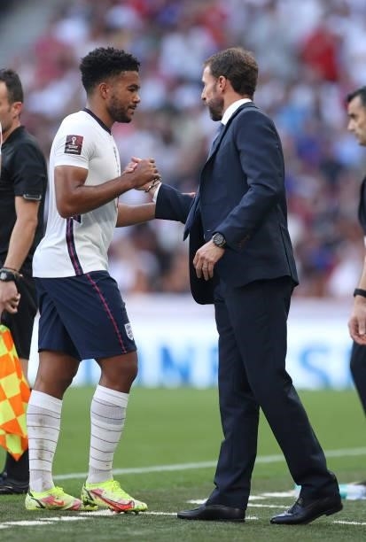 Gareth Southgate, Head Coach of England shakes hands with Reece James of England as he is substituted during the 2022 FIFA World Cup Qualifier match...