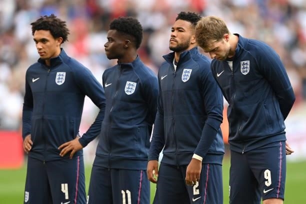 Trent Alexander-Arnold, Bukayo Saka, Reece James and Patrick Bamford of England line up prior to the 2022 FIFA World Cup Qualifier match between...