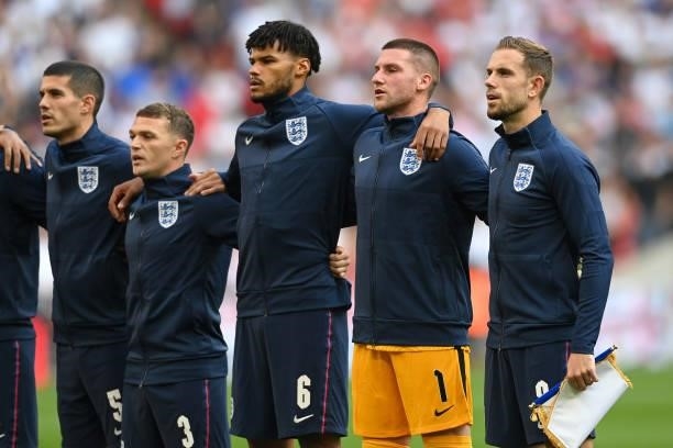Conor Coady, Kieran Trippier, Tyrone Mings, Sam Johnstone and Jordan Henderson of England sing the national anthem prior to the 2022 FIFA World Cup...