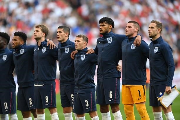 Reece James, Patrick Bamford, Conor Coady, Kieran Trippier, Tyrone Mings, Sam Johnstone and Jordan Henderson of England sing the national anthem...