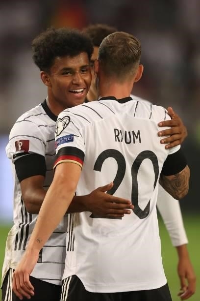 Karim Adeyemi of Germany celebrates scoring the 6th team goal wth his team mate David Raum during the 2022 FIFA World Cup Qualifier match between...