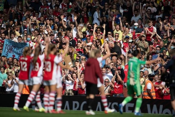 Arsenal fans applaud their team after the Barclays FA Women's Super League match between Arsenal Women and Chelsea Women at Emirates Stadium on...