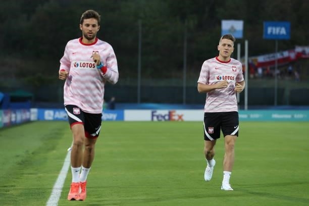 Piotr Zielinski and team mate Bartosz Bereszynski of Poland take part in a training session after being left out of the line up prior to the 2022...