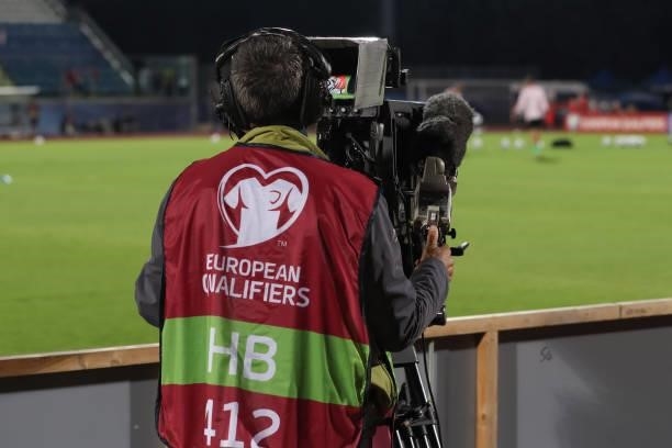 Pitchside Host broadcaster television camera operator films the warm up prior to the 2022 FIFA World Cup Qualifier match between San Marino and...