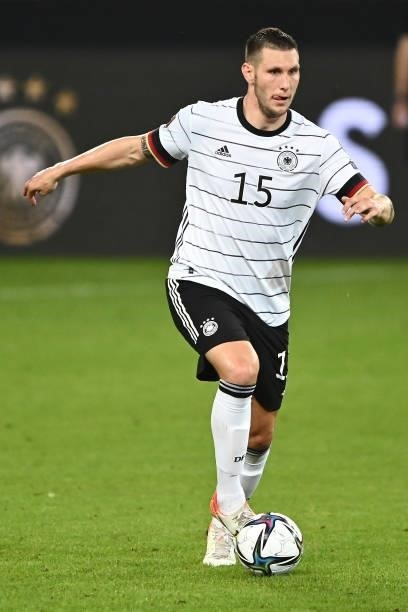 Niklas Suele of Germany controls the ball during the 2022 FIFA World Cup Qualifier match between Germany and Armenia at Mercedes Benz Arena on...