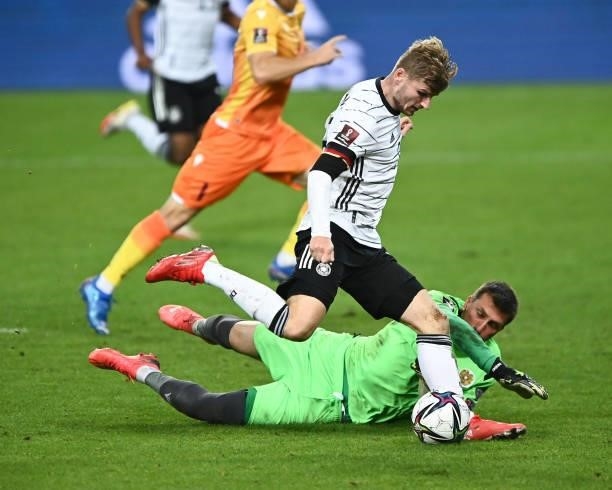 Timo Werner of Germany is tackled by David Yurchenko of Armenia during the 2022 FIFA World Cup Qualifier match between Germany and Armenia at...