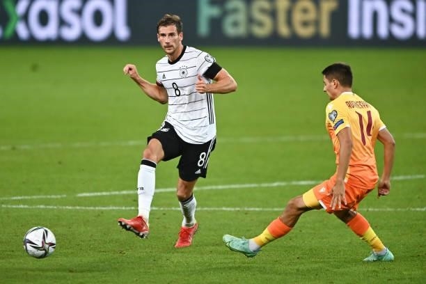 Leon Goretzka of Germany is tackled by Artem Avanesyan of Armenia during the 2022 FIFA World Cup Qualifier match between Germany and Armenia at...