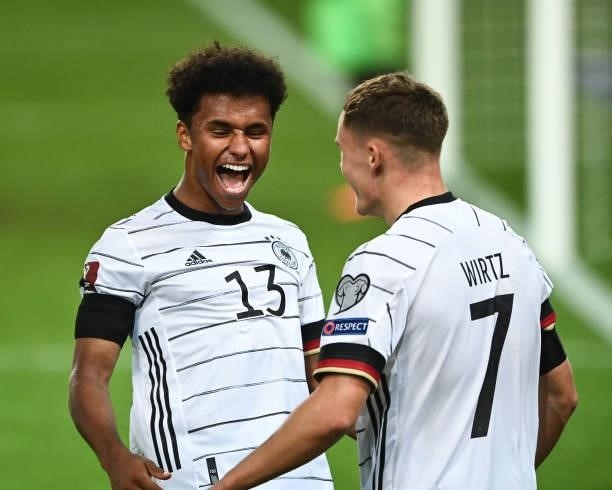 Karim Adeyemi and Florian Wirtz of Germany celebrates their team's sixth goal during the 2022 FIFA World Cup Qualifier match between Germany and...