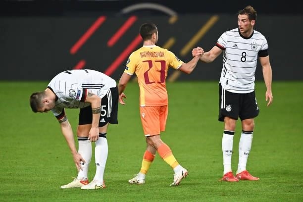 Leon Goretzka of Germany shake hands with Vahan Bichakhchyan of Armenia during the 2022 FIFA World Cup Qualifier match between Germany and Armenia at...