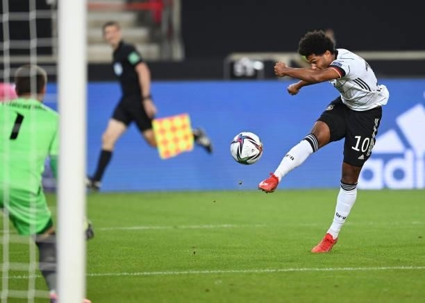 Serge Gnabry scores his team's first goal during the 2022 FIFA World Cup Qualifier match between Germany and Armenia at Mercedes Benz Arena on...