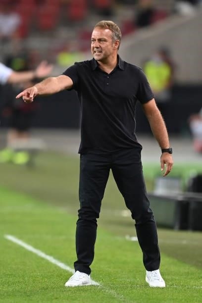 Head Coach Hansi Flick of Germany gives his team instructions during the 2022 FIFA World Cup Qualifier match between Germany and Armenia at Mercedes...