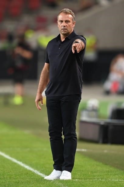 Head Coach Hansi Flick of Germany gives his team instructions during the 2022 FIFA World Cup Qualifier match between Germany and Armenia at Mercedes...