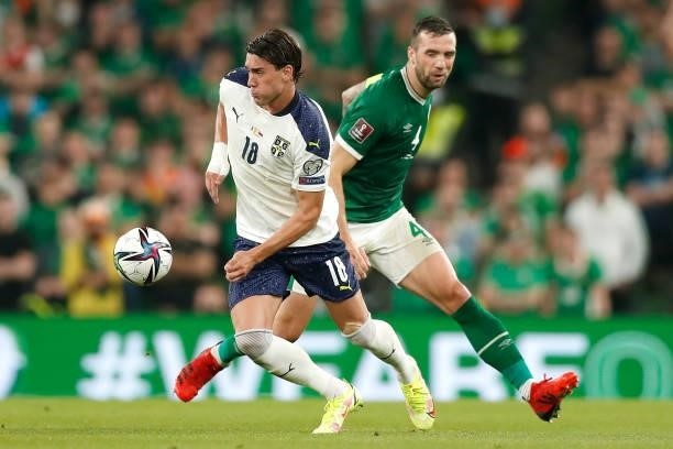 Dusan Vlahovic of Serbia battles for possession with Shane Duffy of Republic of Ireland during the 2022 FIFA World Cup Qualifier match between...